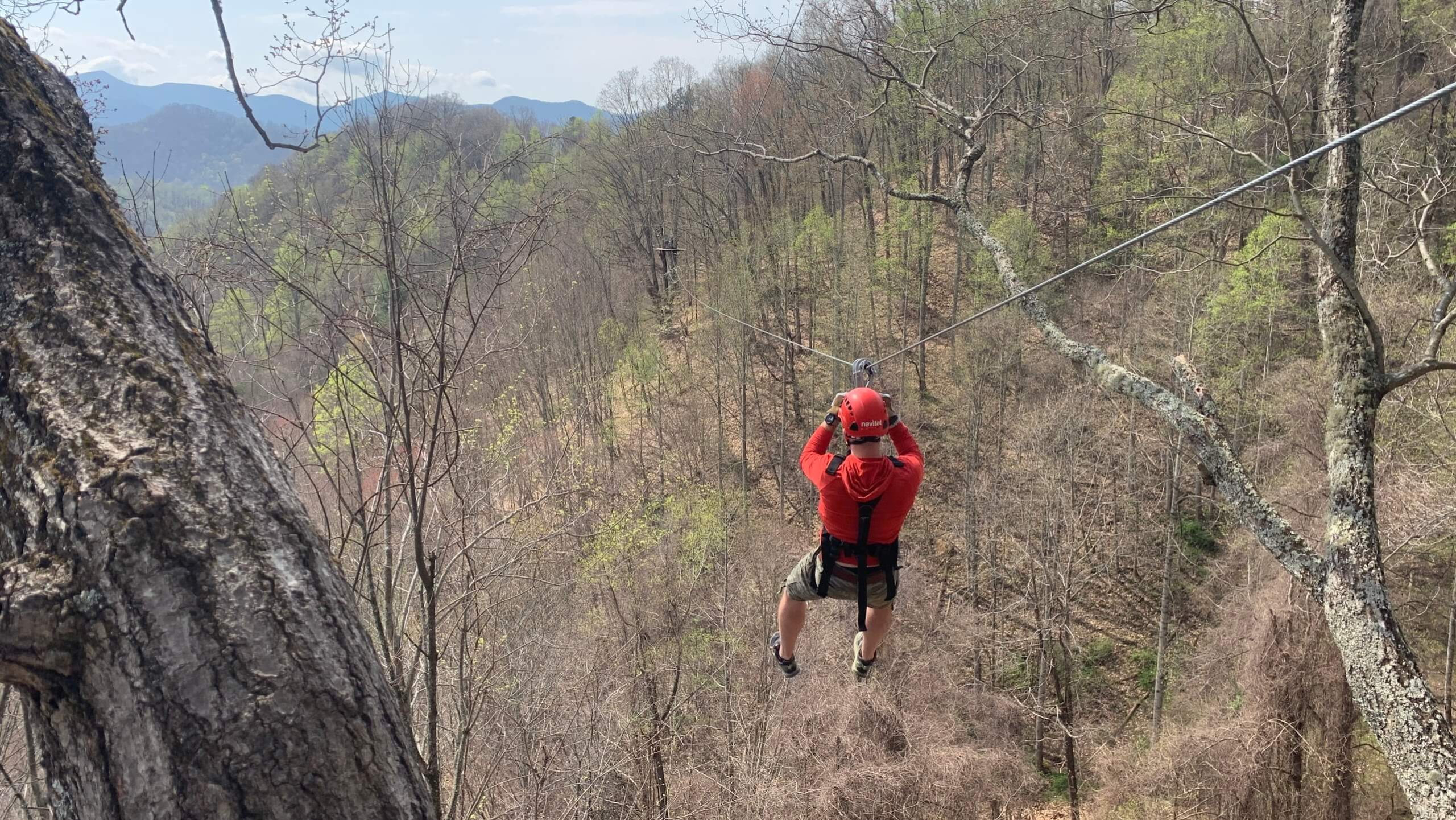 Riding on a zipline in Colorado (Wearing Altra Lone Peaks)