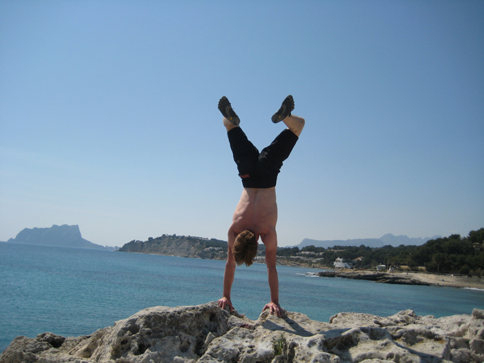 Here we see Ben doing a handstand in Moraira, Spain.  Note his Speed FiveFingers!