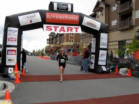 Emily crossing the finish line