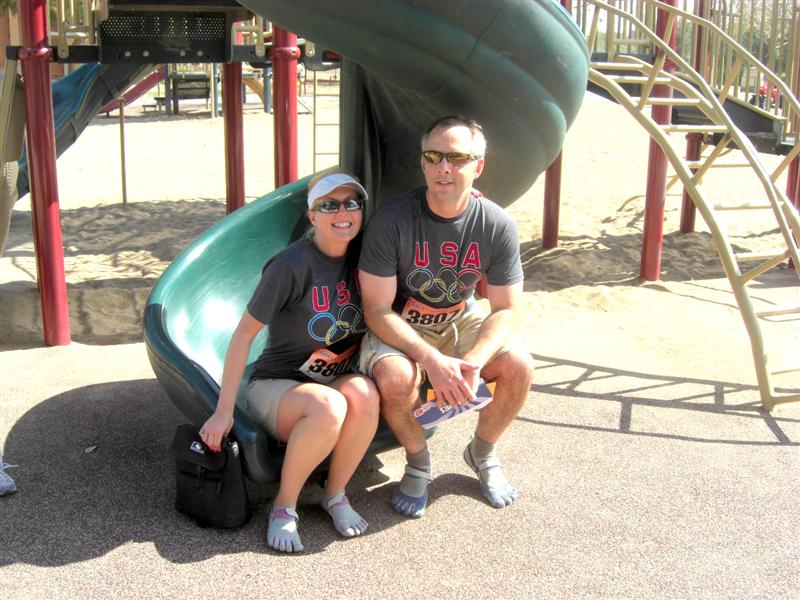 Jenn and her husband pose on a slide in Phoenix in their Vibram Five Fingers KSOs.  The slide was the location of a clue in the scavenger hunt race to benefit St. Judes called the Great Urban Race.