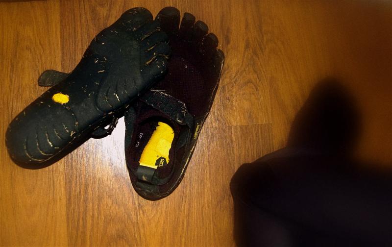 Dirty black KSO FiveFingers after a run.