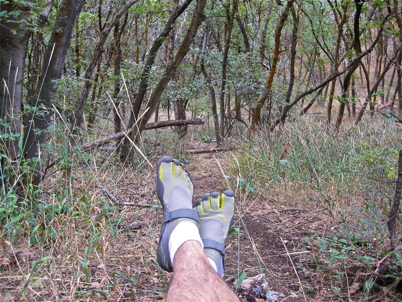 Fivefingers make mid-trail-run relaxation look easy!