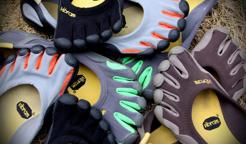 A pile of the open-topped Classic Vibram Five Fingers, the original "barefoot shoe" from Vibram and the most minimal, outdoor-use VFF available.