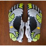 The Women's KomodoSport FiveFingers in light grey and green.
